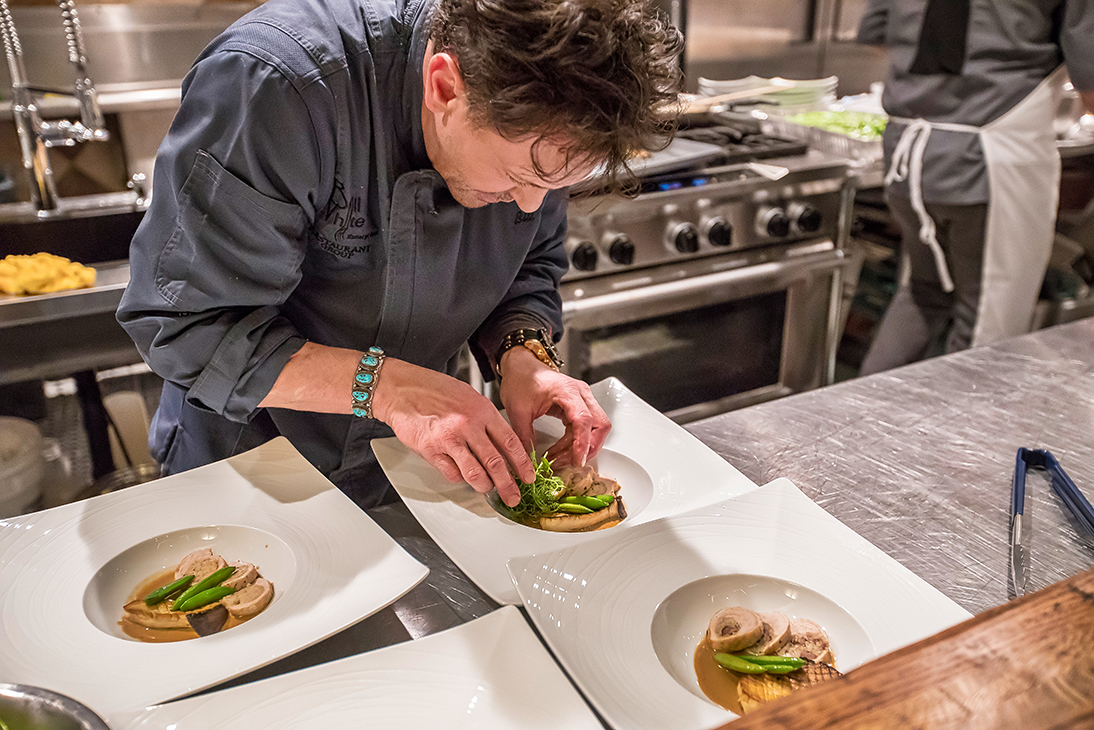Bill White prepares the Entree: stuffed farm turkey "fricasse", risotto stuffing with wild mushroom-marsala cream.&nbsp;